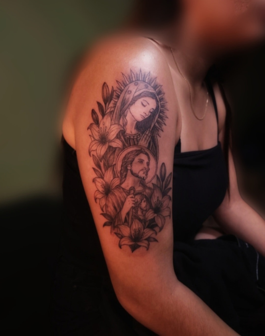 Resiliencia cursive tattoo on forearm