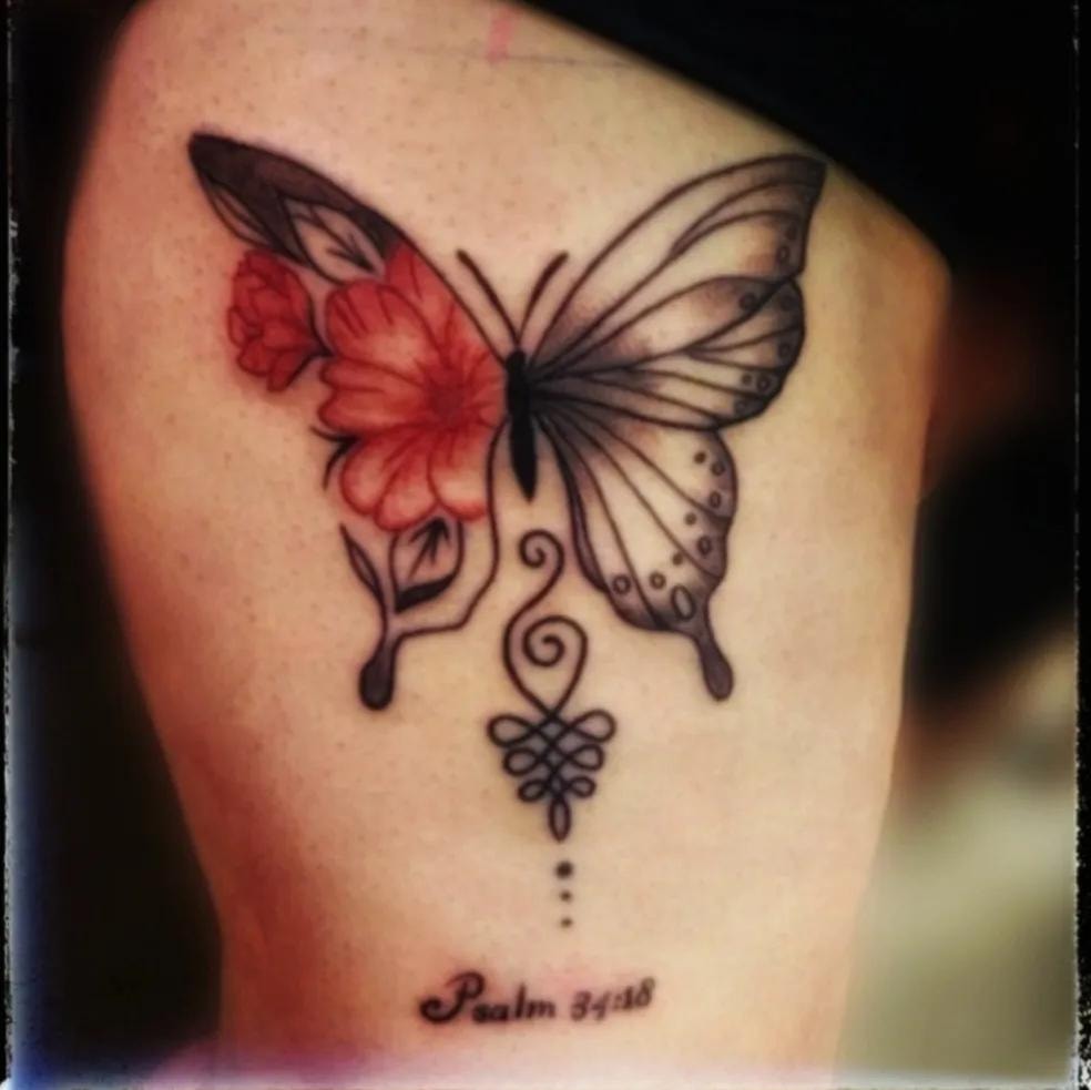 Phoenix tattoo on upper arm in red and brown