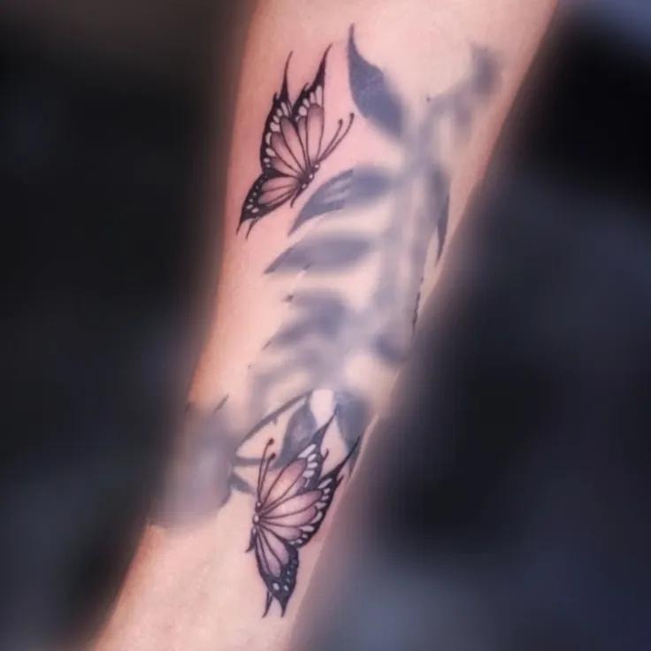 Lighter flame flower tattoo on forearm